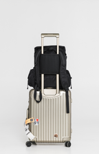 Rear of the Black Cruiser secured over a rolling suitcase handle