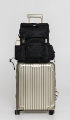 Front view of the Black Cruiser on a rolling suitcase