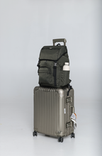 Side view of the Olive Cruiser on a rolling suitcase