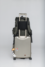 Rear of the Olive Cruiser secured over a rolling suitcase handle