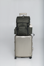 Front view of the Olive Cruiser on a silver rolling suitcase